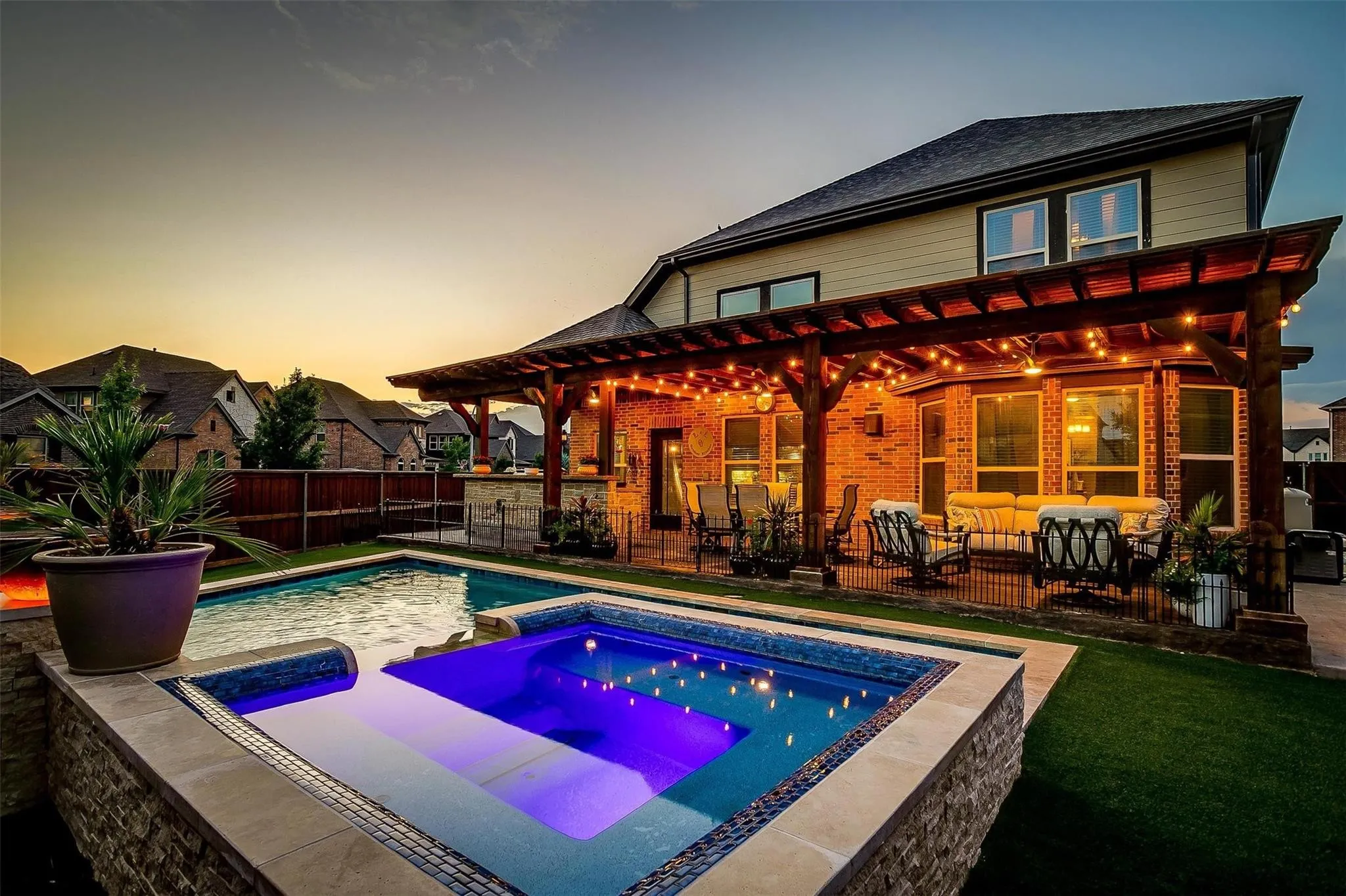 Custom outdoor living space with pergola and fire pit in Southlake Texas