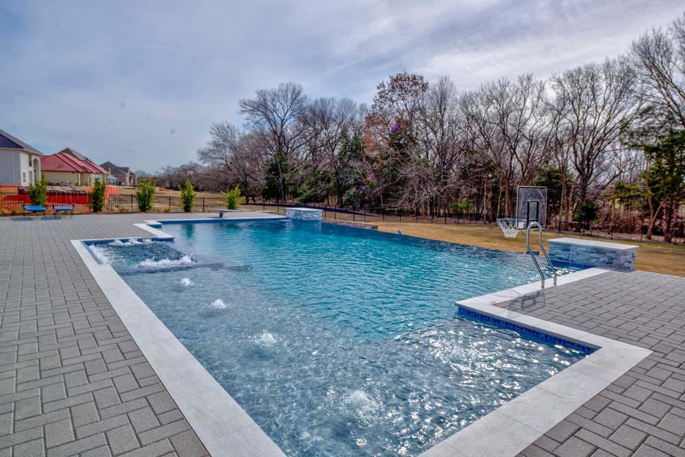 Custom new pool construction with waterfall and spa in Frisco Texas